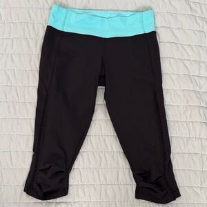 lululemon athletica woman’s Black cropped Leggings with Blue Waistband